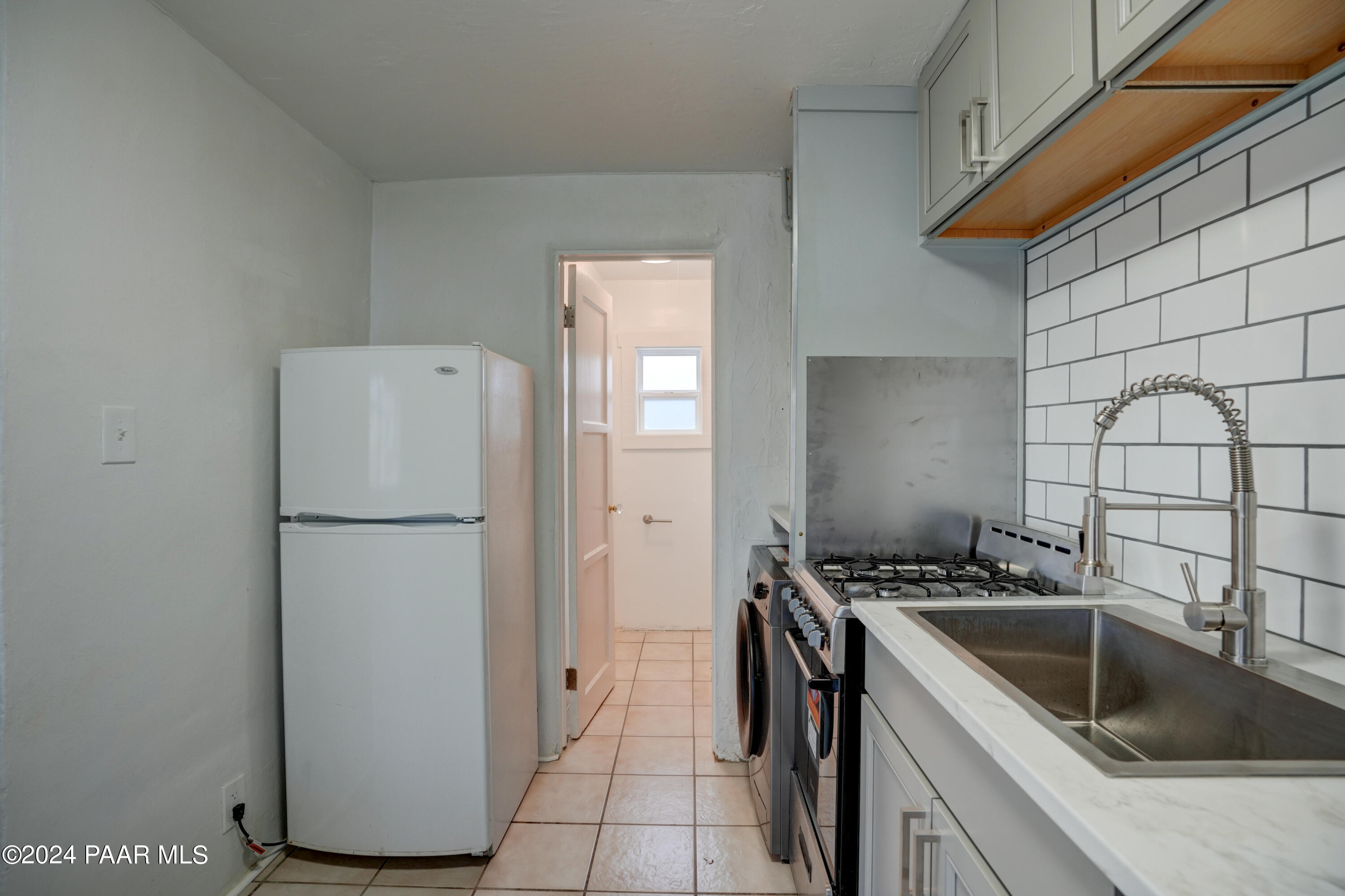 925 Ruth Street, Unit B Prescott, AZ 86301 - Photo 8 of 15 a kitchen with a refrigerator and a sink