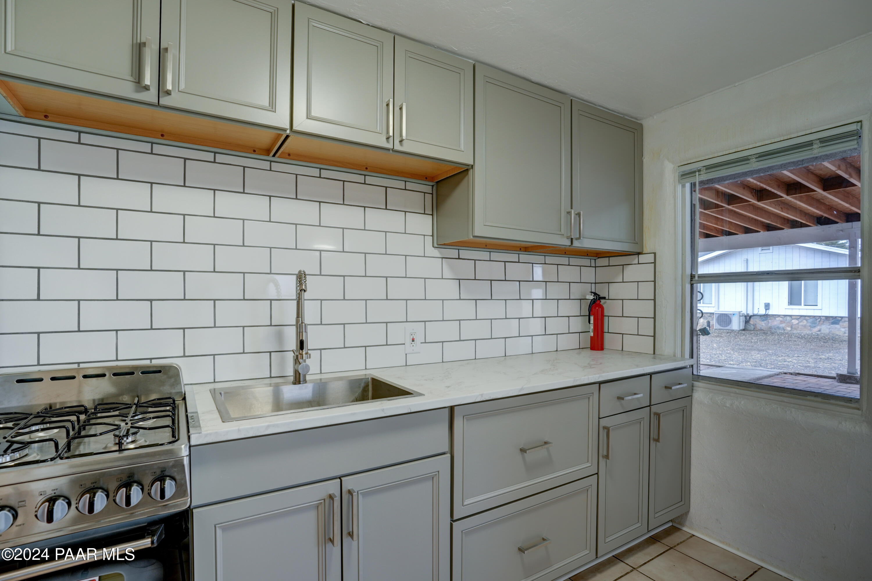 925 Ruth Street, Unit B Prescott, AZ 86301 - Photo 9 of 15 a kitchen with a sink and cabinets