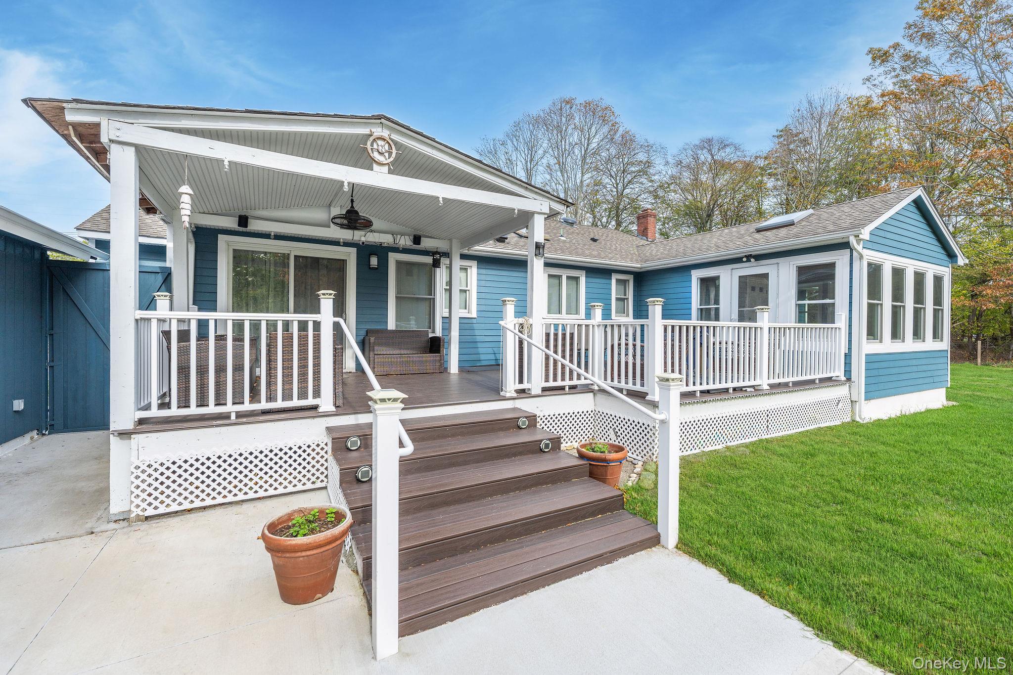 10940 Main Road East Marion, NY 11939 - Photo 24 of 38 a front view of a house with a yard
