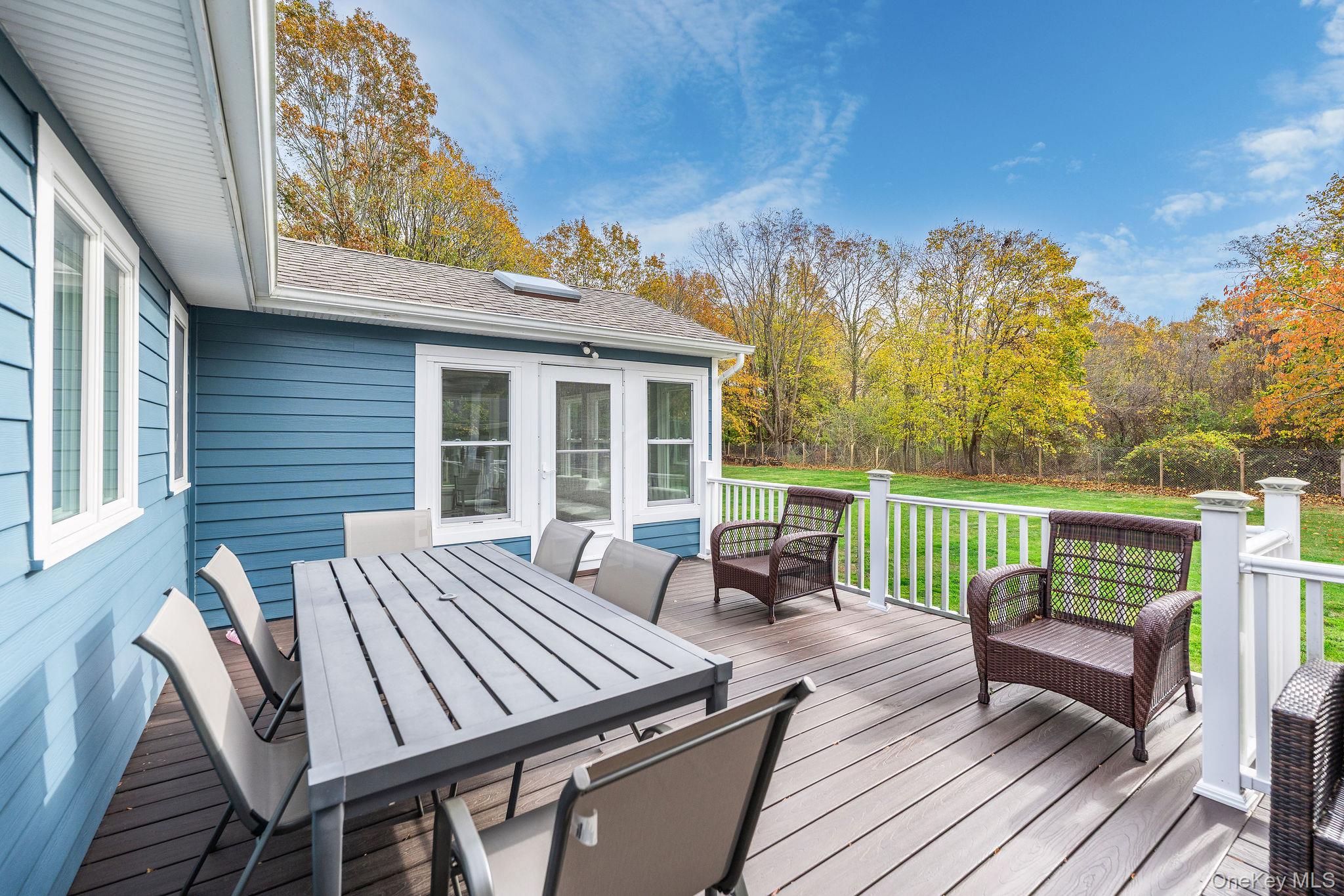 10940 Main Road East Marion, NY 11939 - Photo 26 of 38 a view of a patio with a yard
