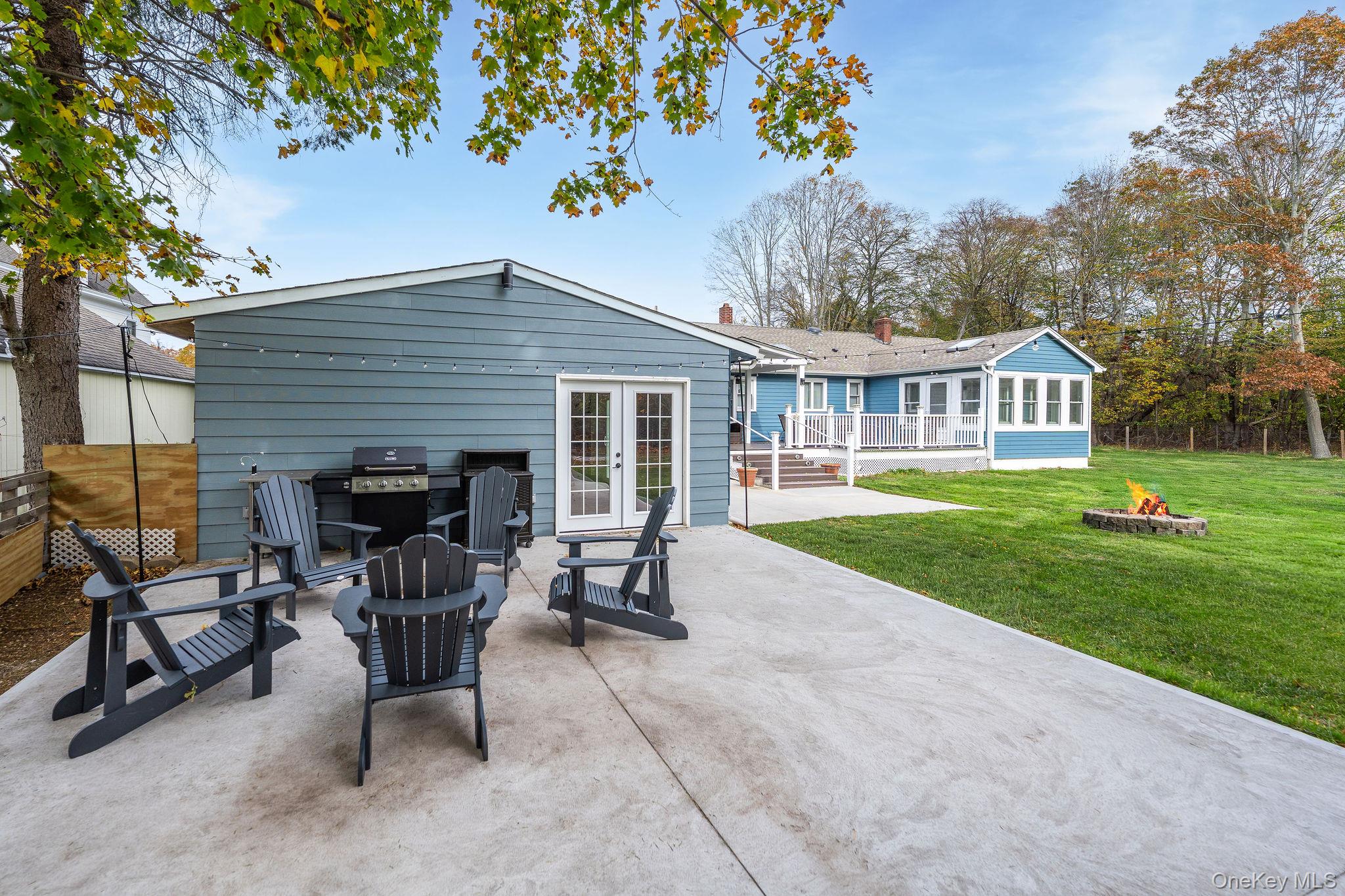 10940 Main Road East Marion, NY 11939 - Photo 29 of 38 a view of a house with backyard porch and sitting area