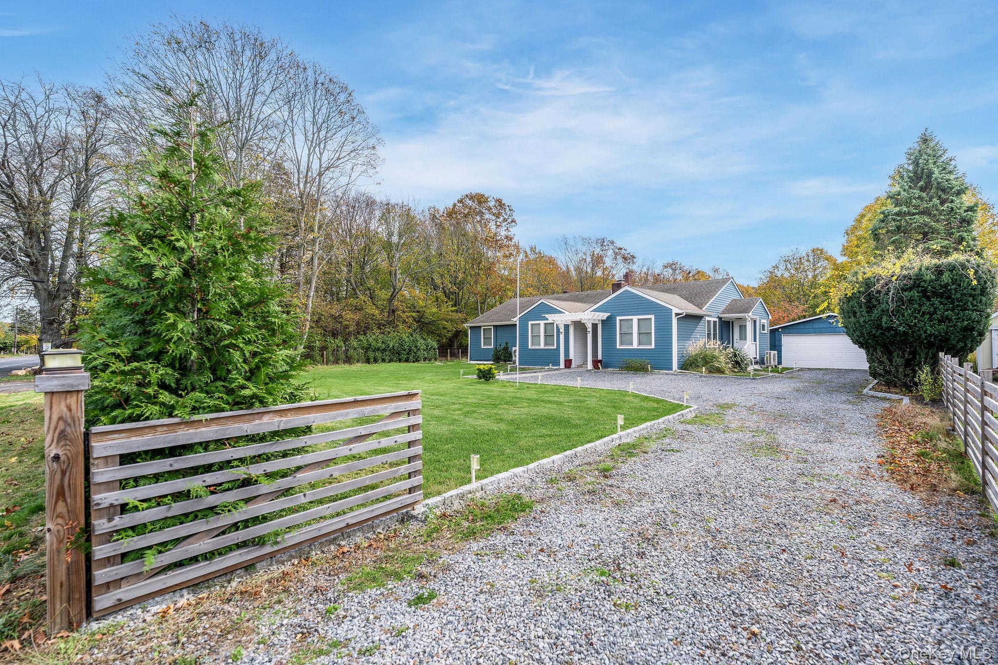 10940 Main Road East Marion, NY 11939 - Photo 34 of 38 a view of house with garden