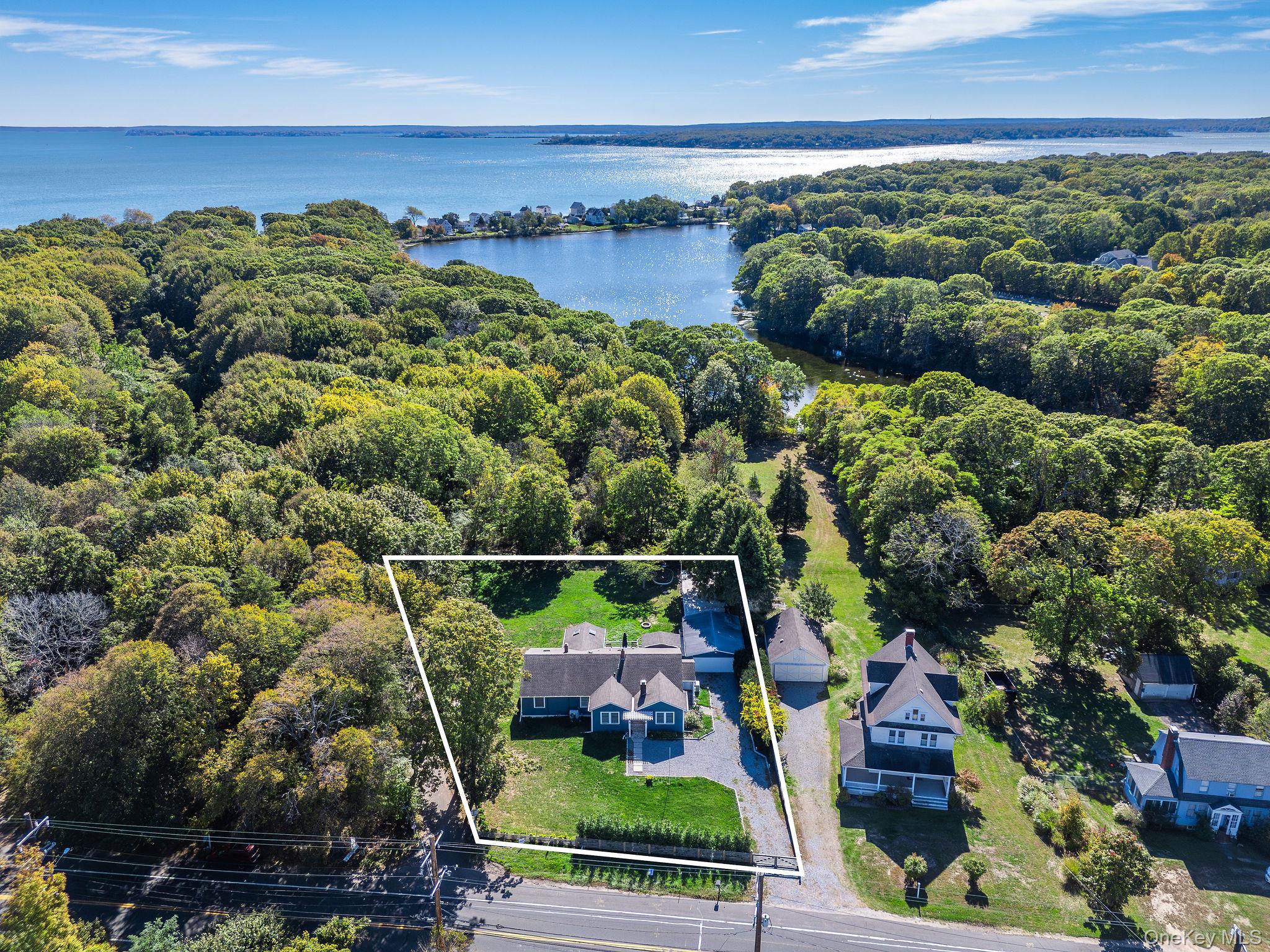 10940 Main Road East Marion, NY 11939 - Photo 36 of 38 a view of a swimming pool and outdoor seating