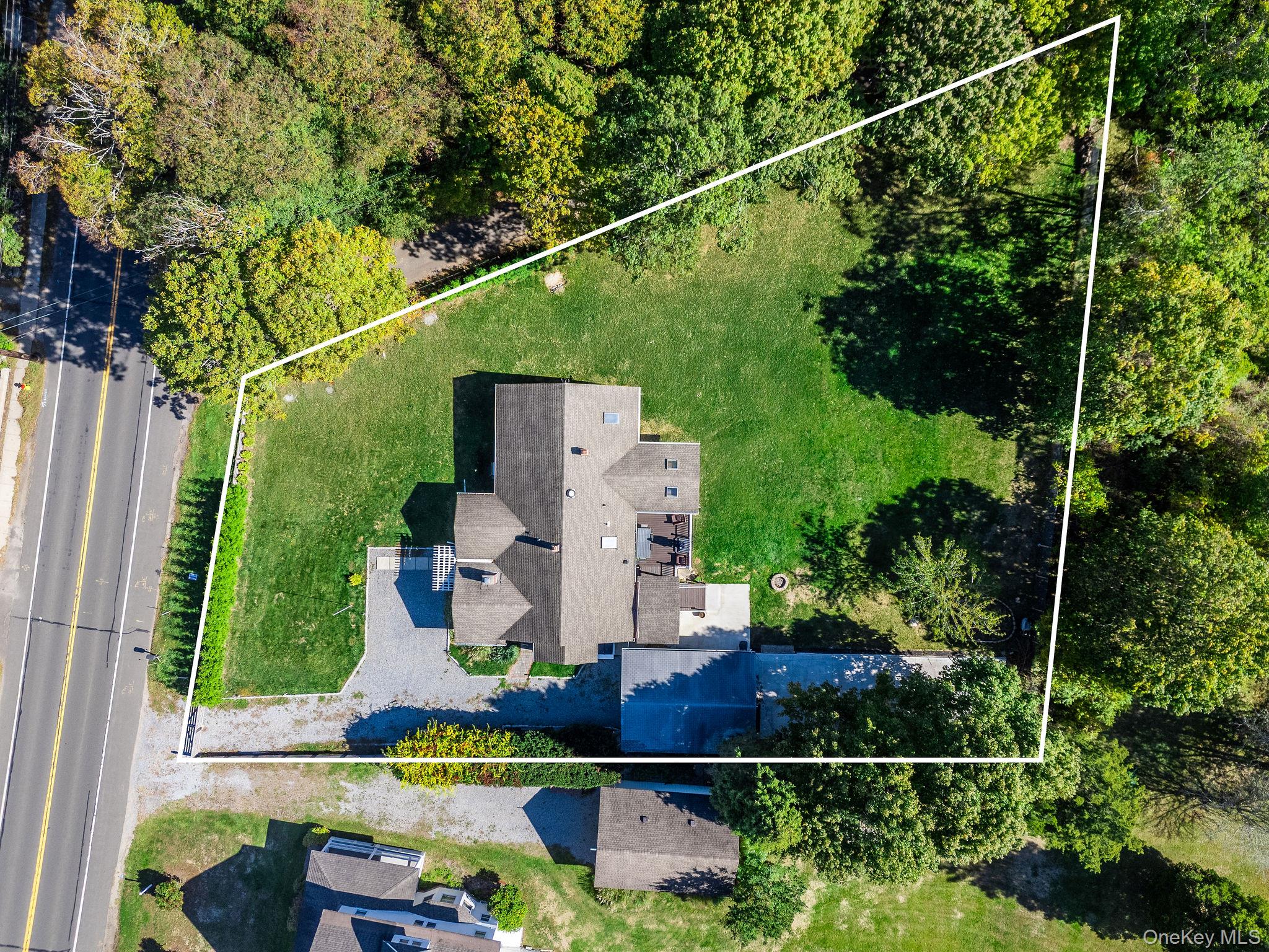 10940 Main Road East Marion, NY 11939 - Photo 38 of 38 an aerial view of a house with swimming pool and garden