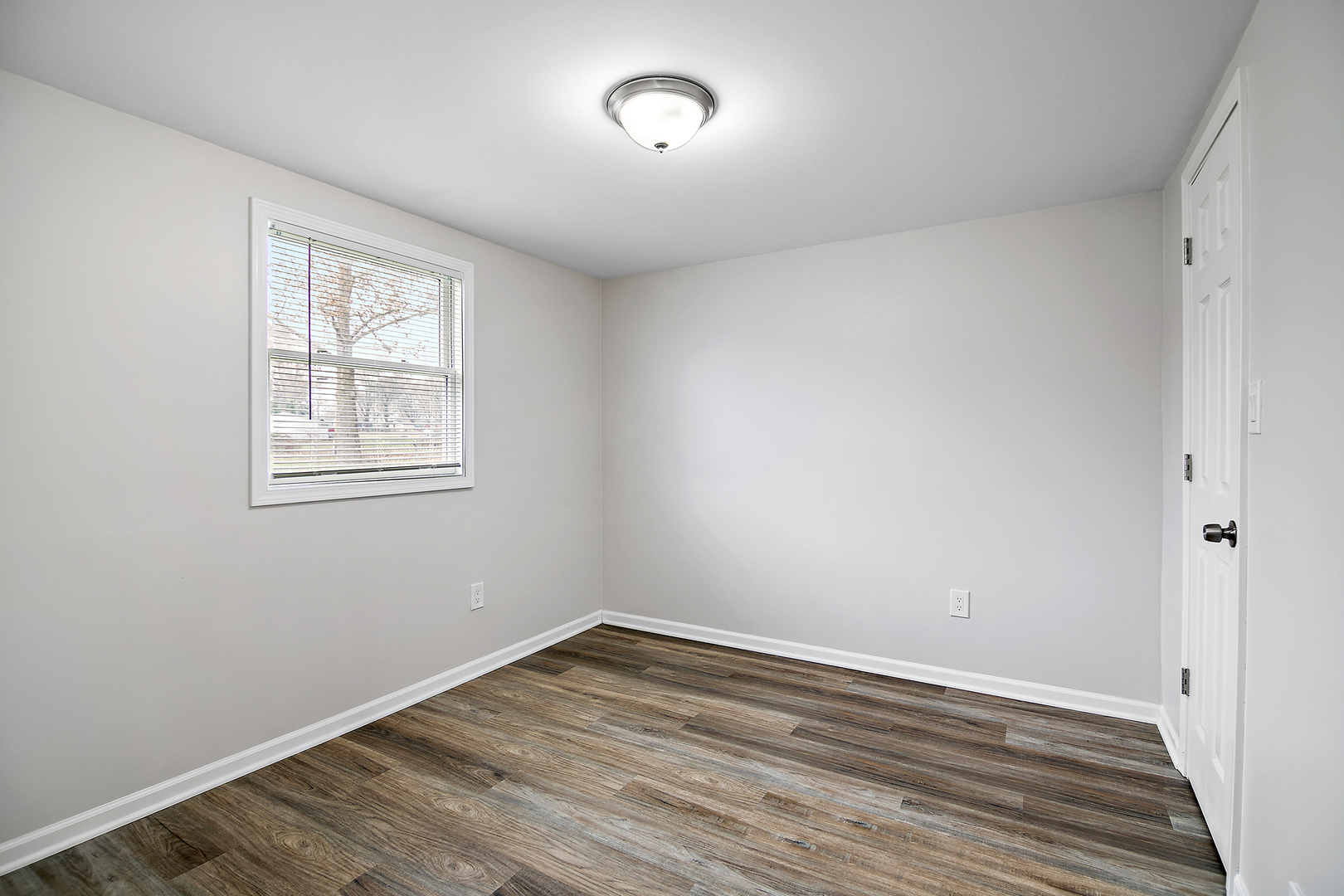 749 West New Monee Road Crete, IL 60417 - Photo 11 of 17 wooden floor in an empty room with a window