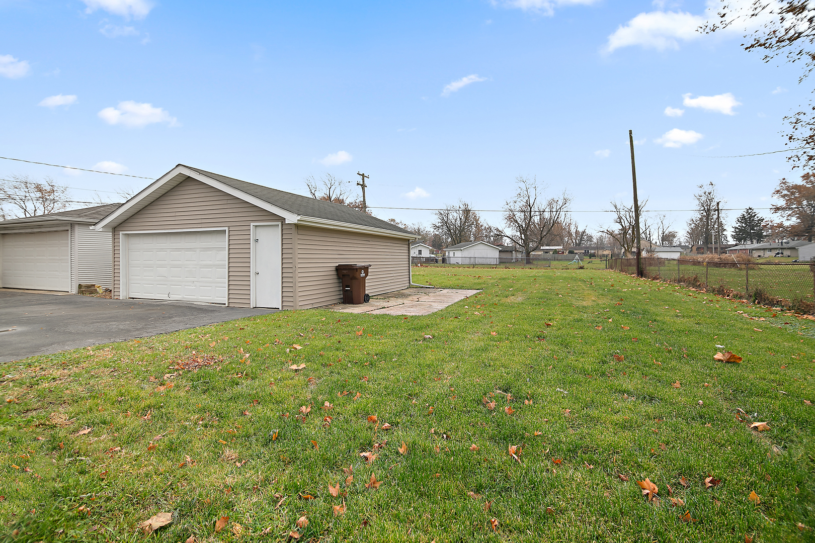 749 West New Monee Road Crete, IL 60417 - Photo 14 of 17 a view of a house with a backyard and a tree