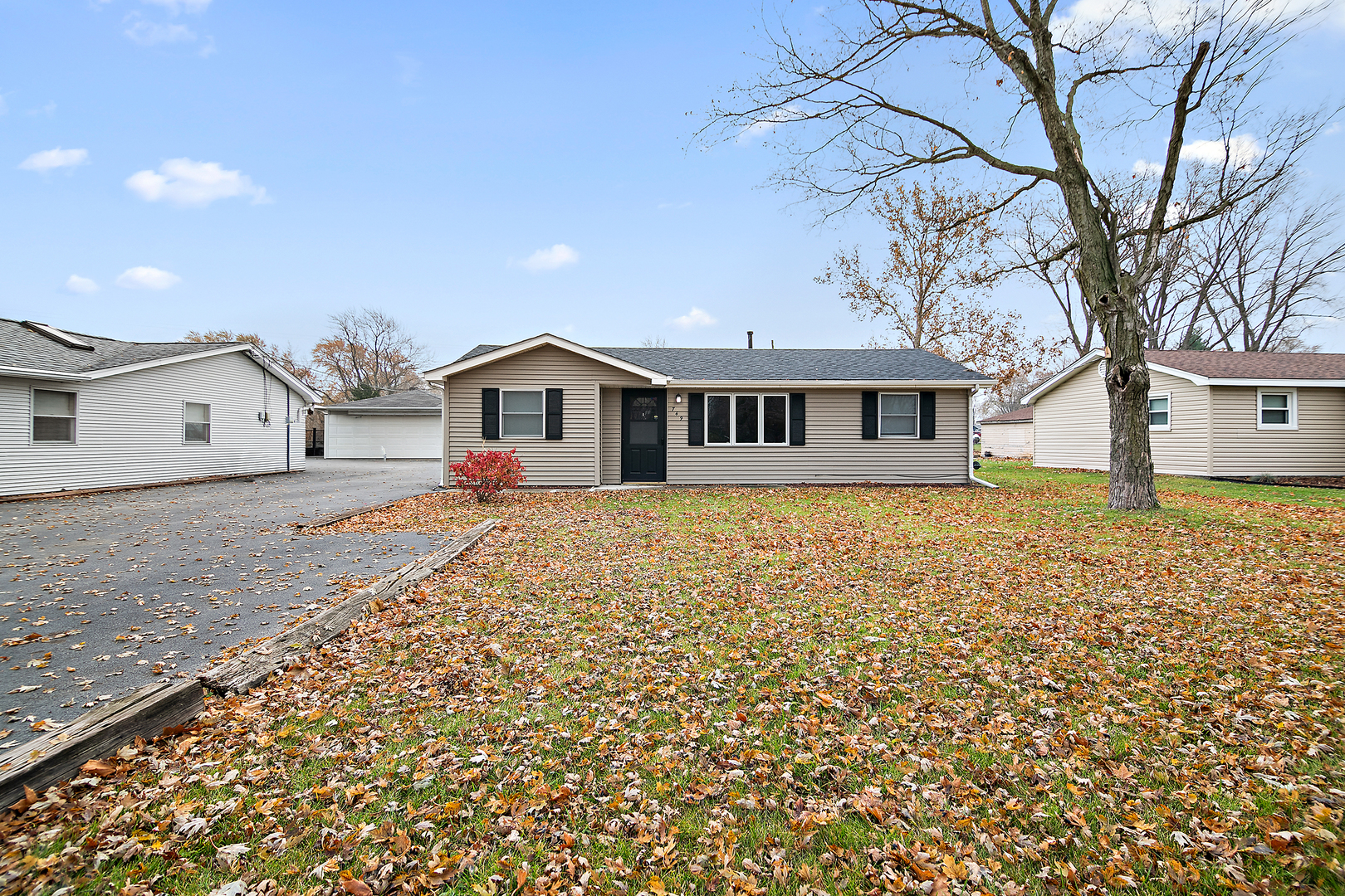749 West New Monee Road Crete, IL 60417 - Photo 2 of 17 a front view of a house with a garden