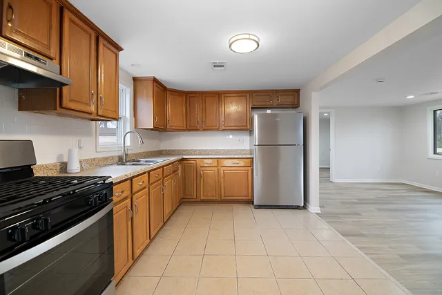 a kitchen with a cabinets and a stove top oven