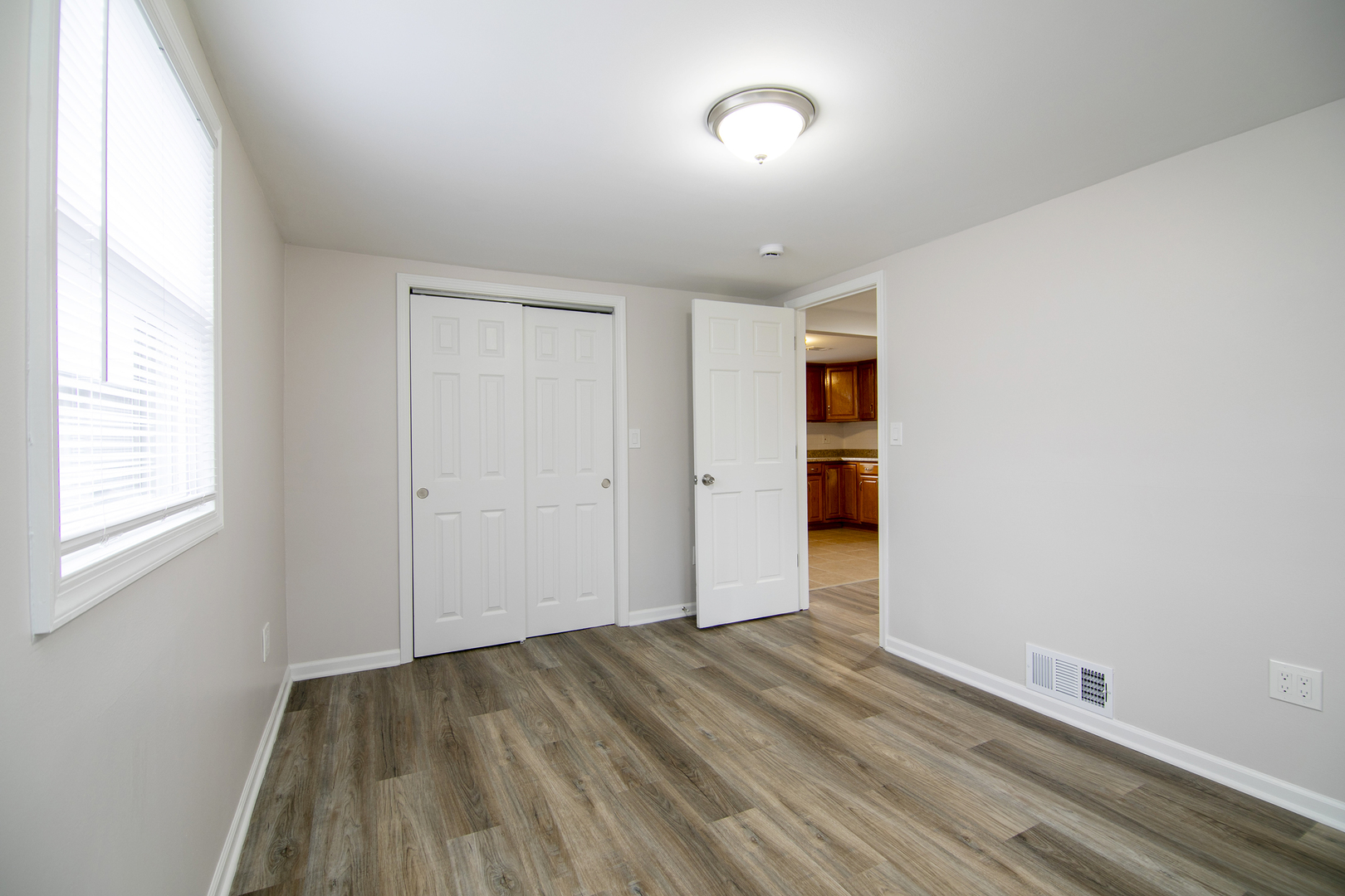 749 West New Monee Road Crete, IL 60417 - Photo 8 of 17 an empty room with closet and windows