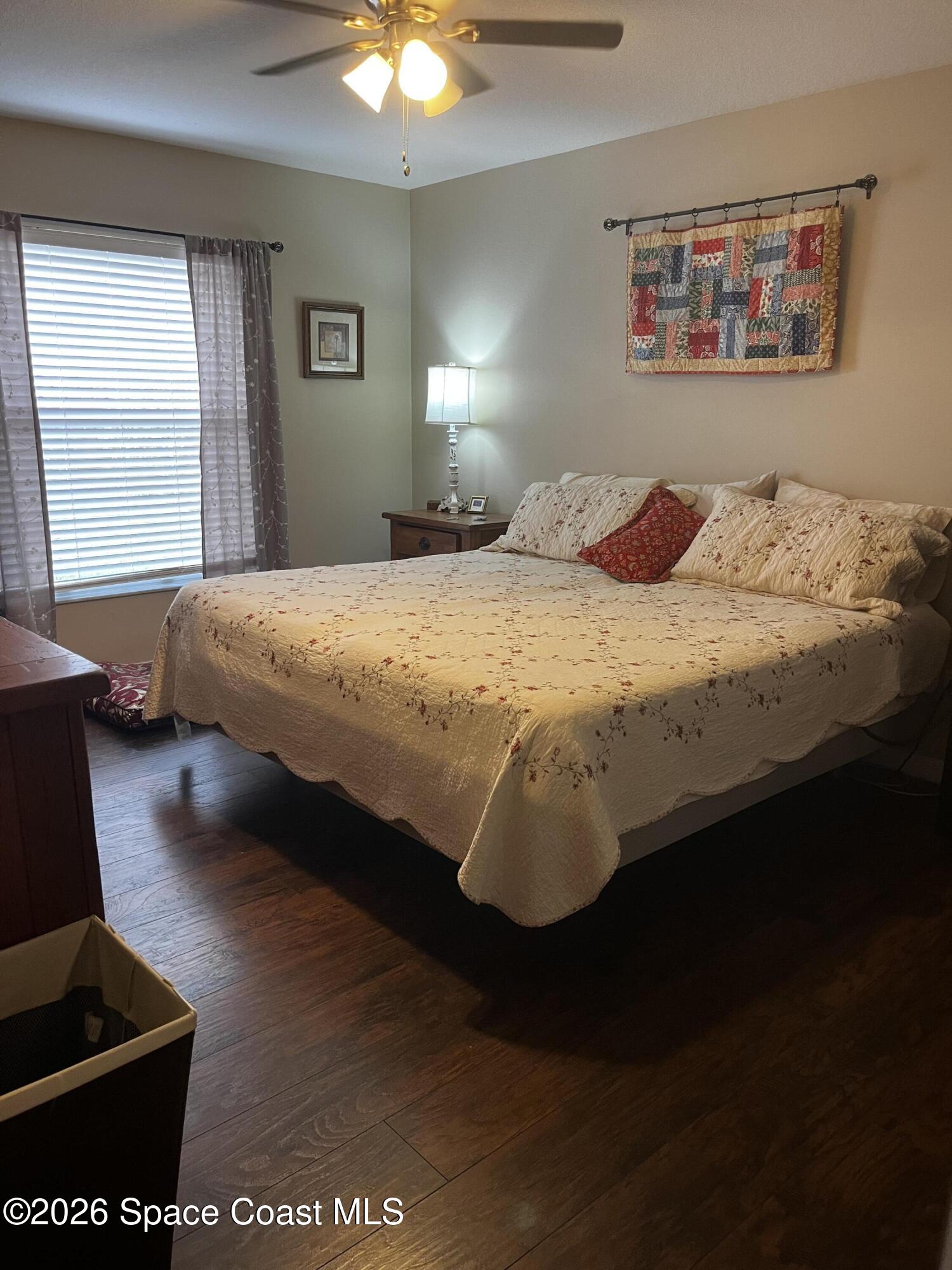 1219 Walnut Grove Way Rockledge, FL 32955 - Photo 14 of 23 a bedroom with a bed and a window