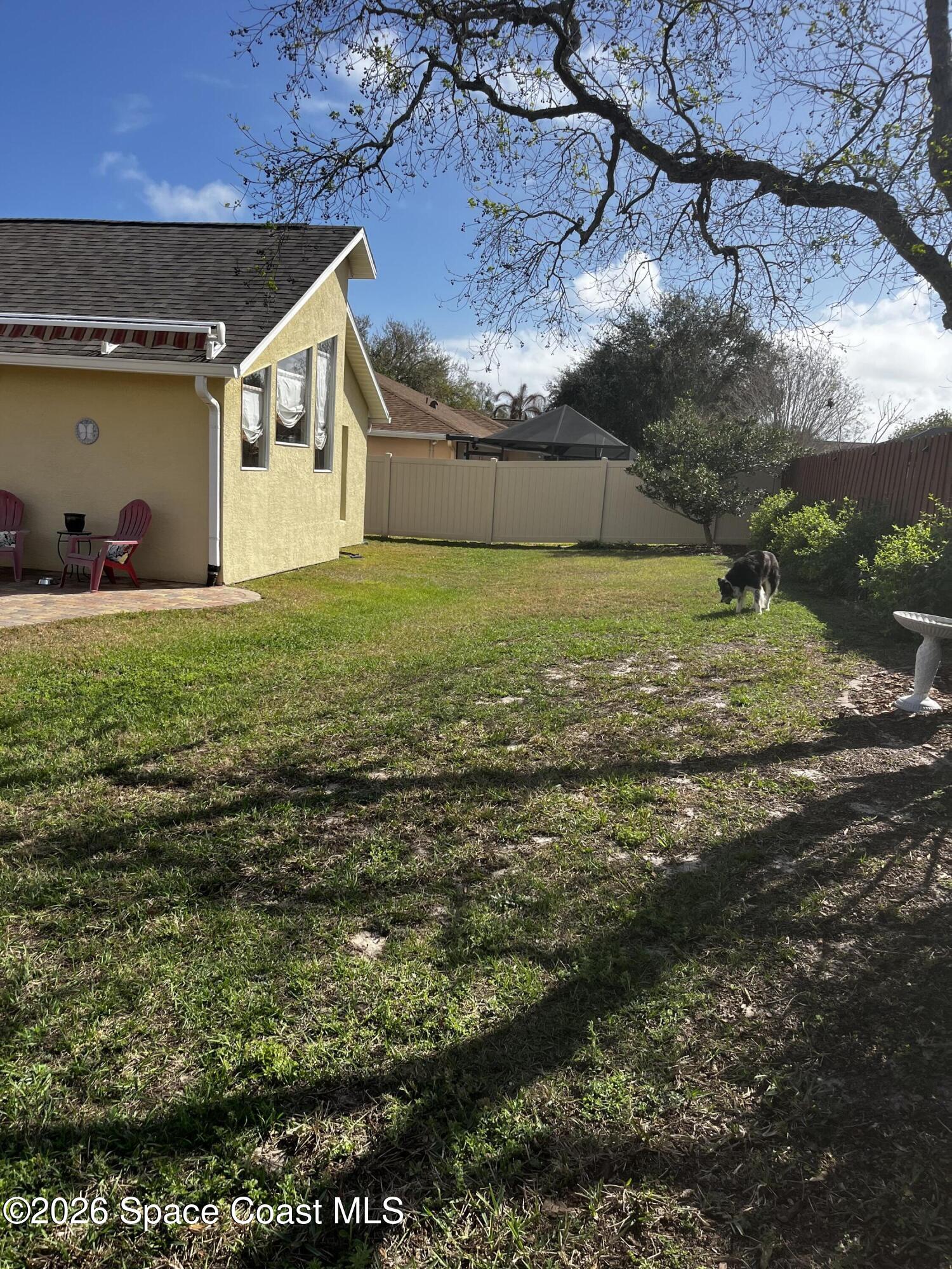 1219 Walnut Grove Way Rockledge, FL 32955 - Photo 18 of 23 a view of a backyard