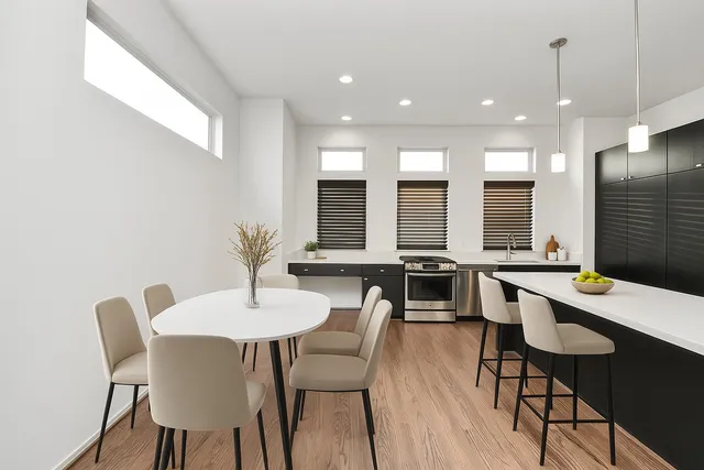 a dining room with furniture and wooden floor