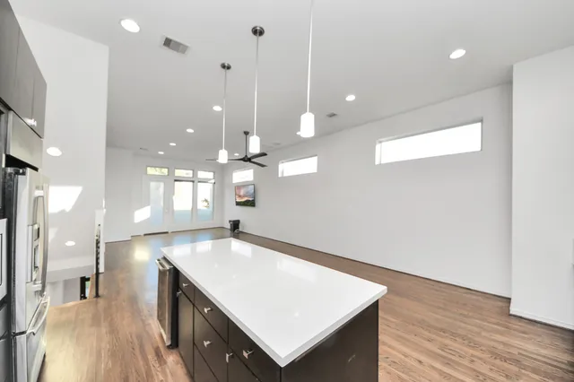 a dining room with furniture and wooden floor