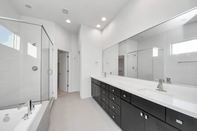 a spacious bathroom with a bathtub and a shower