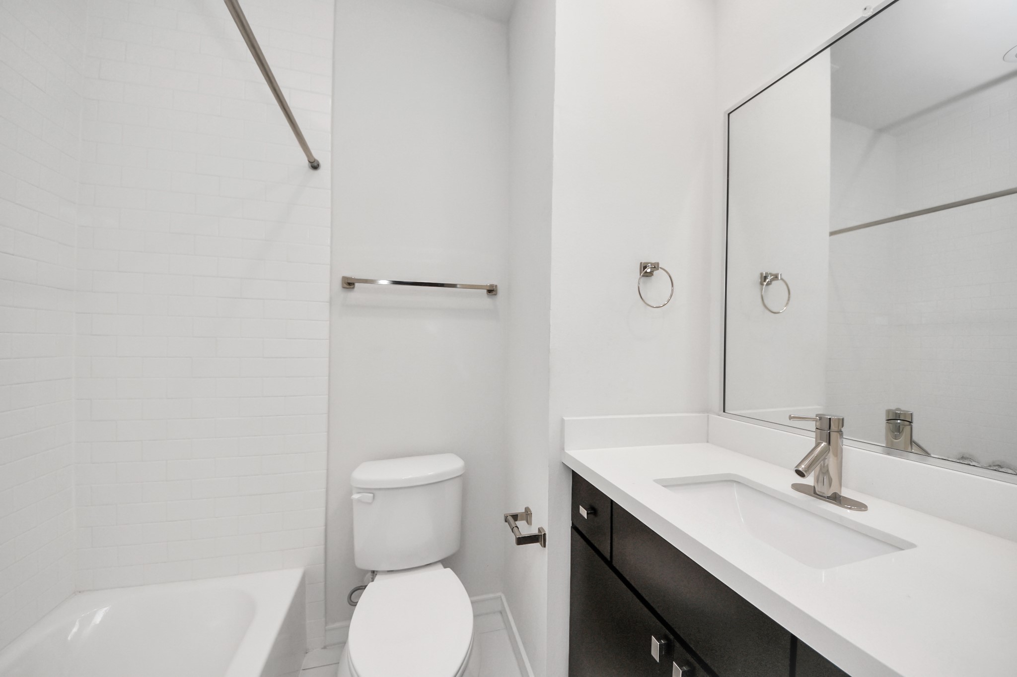 1315 Nagle Street Houston, TX 77003 - Photo 25 of 29 a bathroom with a sink a toilet and shower