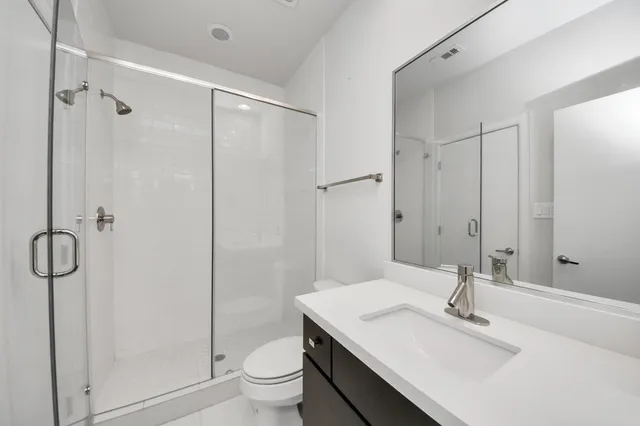 a kitchen with stainless steel appliances a refrigerator sink and stove