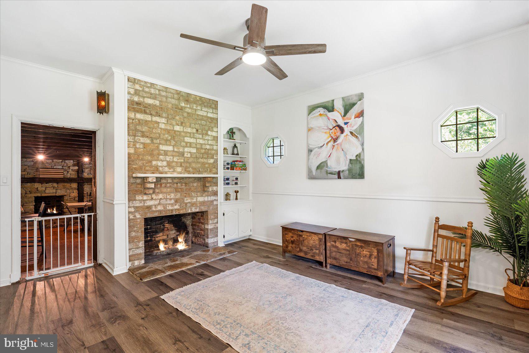 972 Bird River Beach Road Middle River, MD 21220 - Photo 16 of 50 a living room with furniture and a fireplace