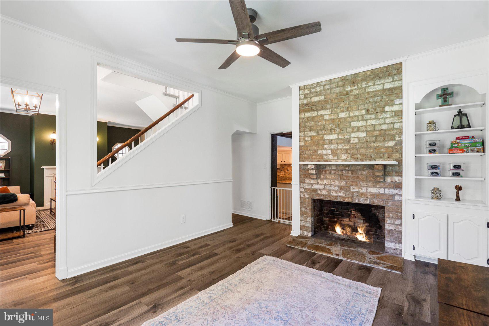972 Bird River Beach Road Middle River, MD 21220 - Photo 18 of 50 a living room with furniture and a fireplace