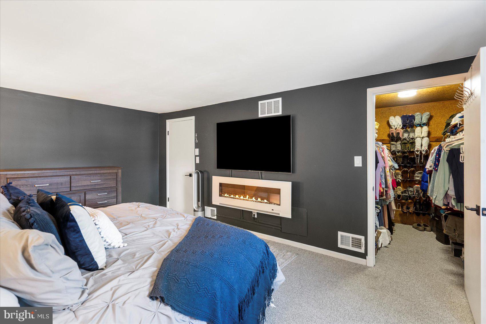 972 Bird River Beach Road Middle River, MD 21220 - Photo 21 of 50 a bedroom with a bed and a flat screen tv