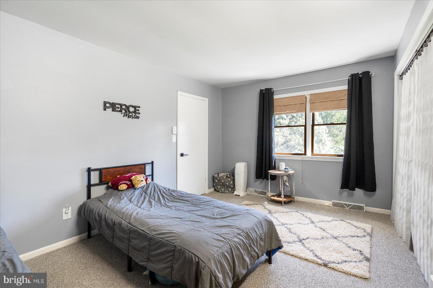 972 Bird River Beach Road Middle River, MD 21220 - Photo 26 of 50 a bedroom with a bed and a window