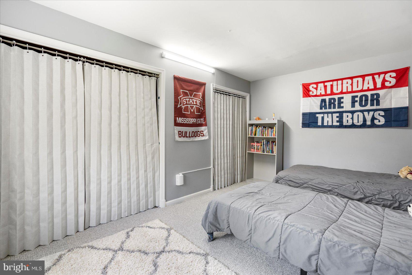972 Bird River Beach Road Middle River, MD 21220 - Photo 27 of 50 a bedroom with a bed and a book shelf