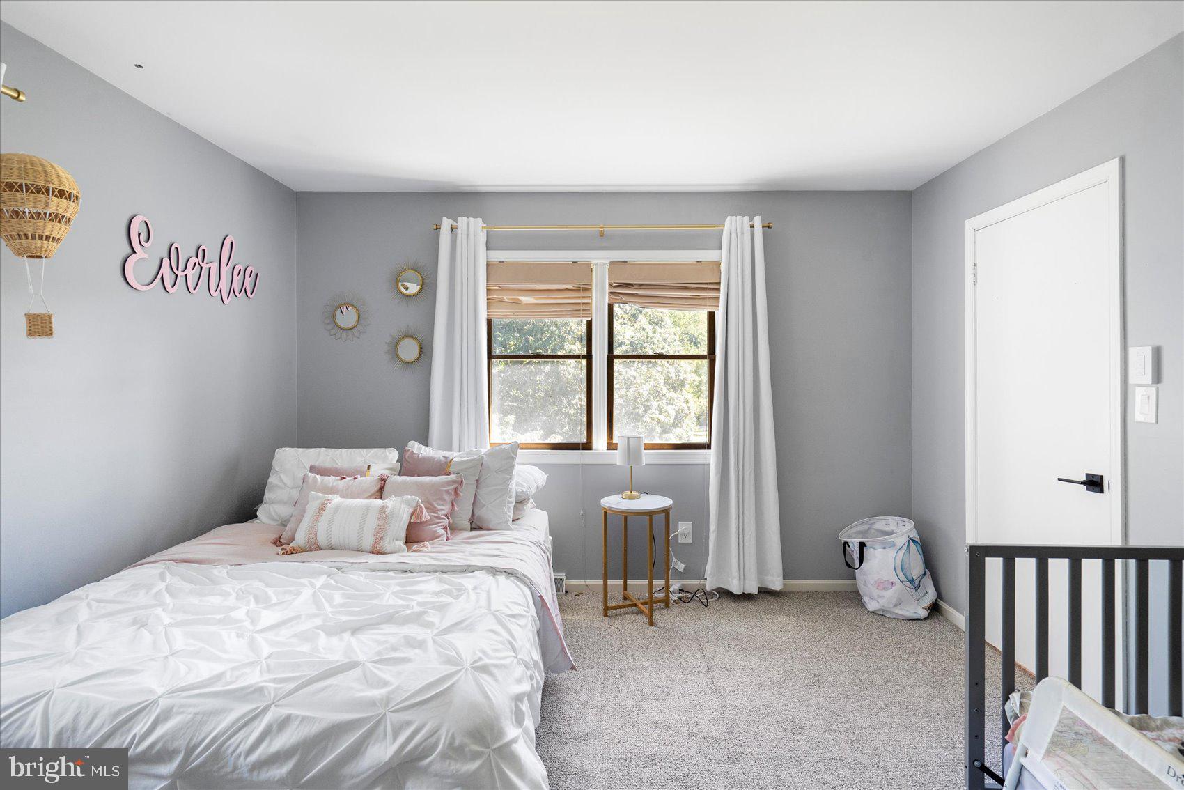 972 Bird River Beach Road Middle River, MD 21220 - Photo 29 of 50 a bedroom with a bed and a window