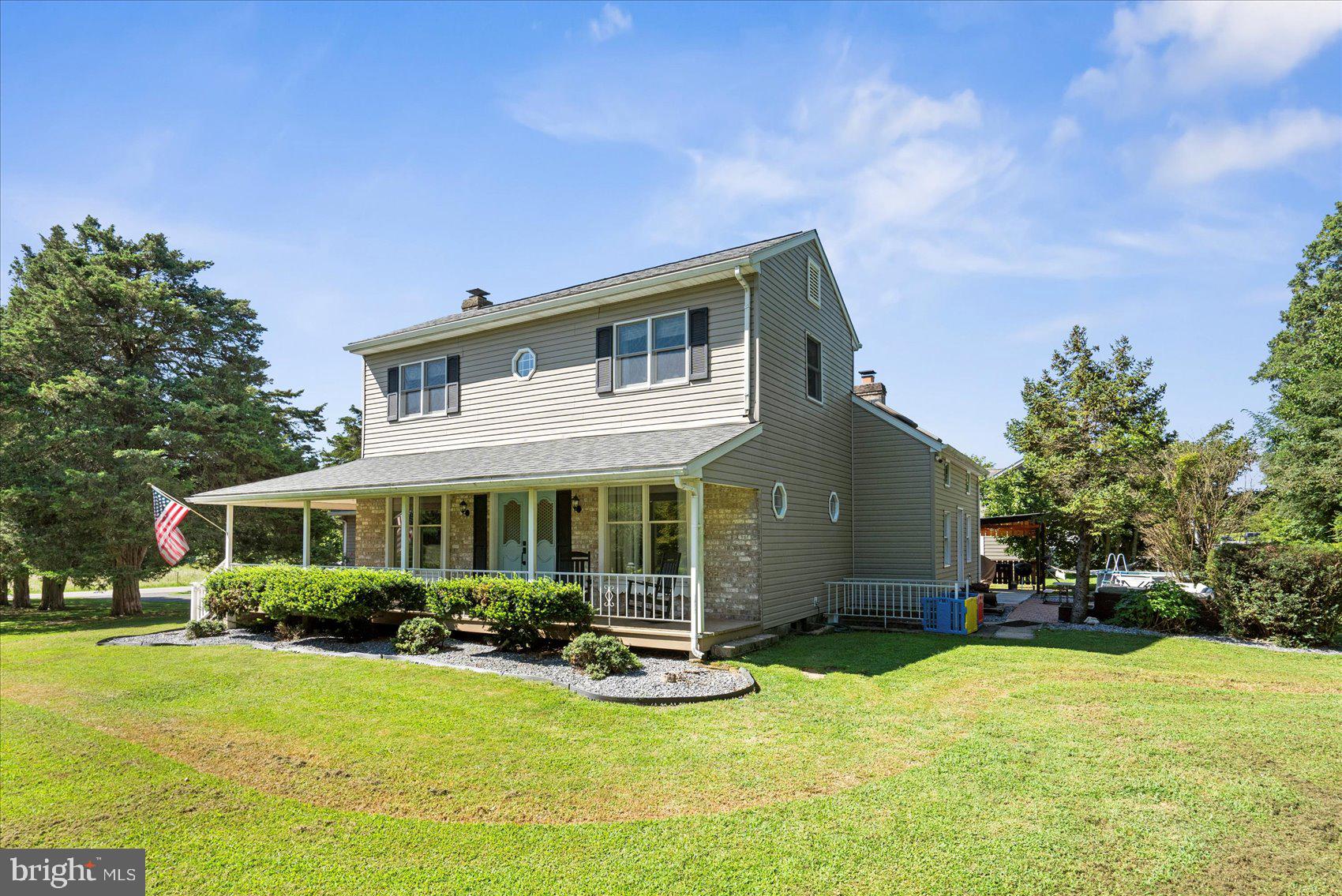 972 Bird River Beach Road Middle River, MD 21220 - Photo 3 of 50 a front view of house with yard and green space
