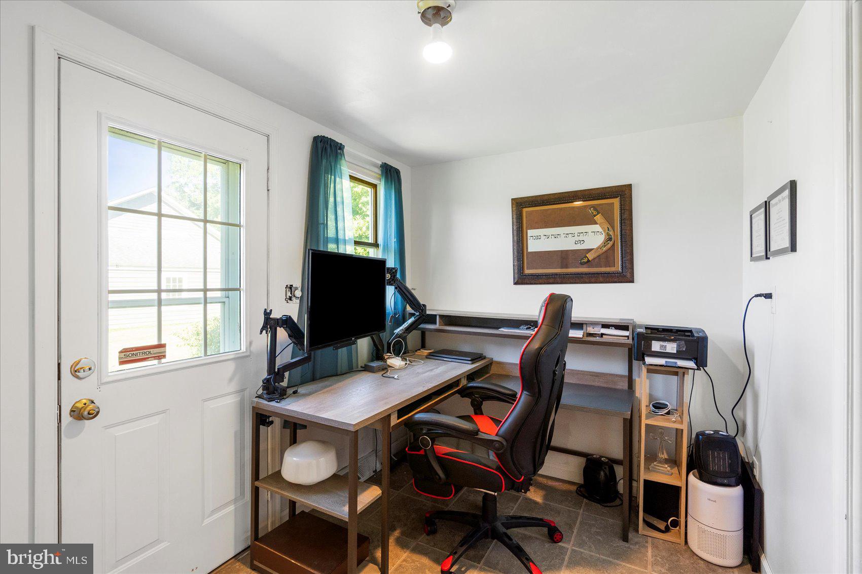 972 Bird River Beach Road Middle River, MD 21220 - Photo 32 of 50 a view of a workspace with furniture and a window