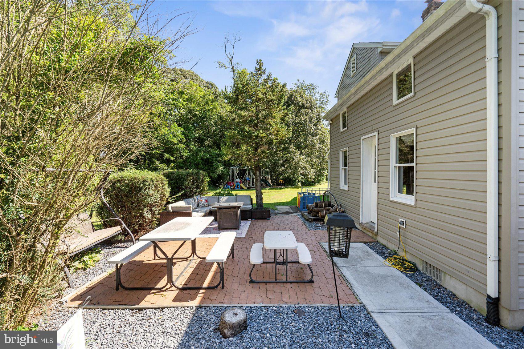 972 Bird River Beach Road Middle River, MD 21220 - Photo 35 of 50 a view of a patio with table and chairs and potted plants