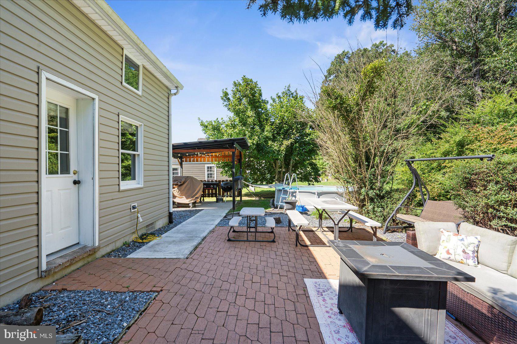 972 Bird River Beach Road Middle River, MD 21220 - Photo 36 of 50 a view of a patio with couches chairs and a potted plant