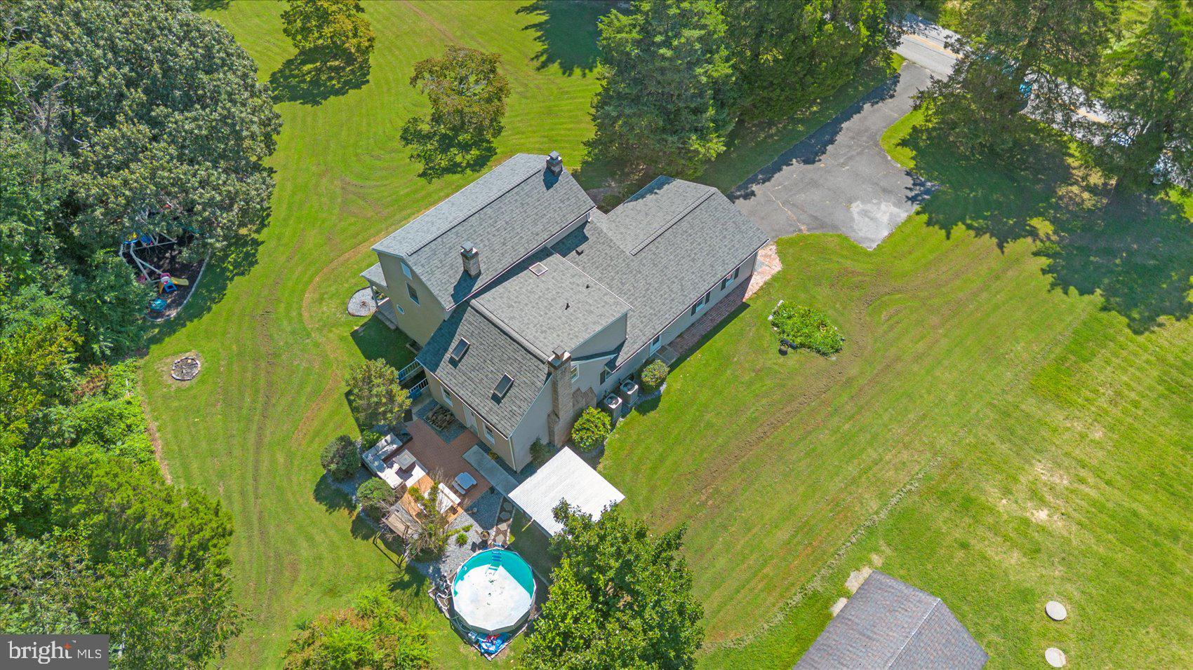 972 Bird River Beach Road Middle River, MD 21220 - Photo 39 of 50 an aerial view of a house with a yard swimming pool and outdoor seating