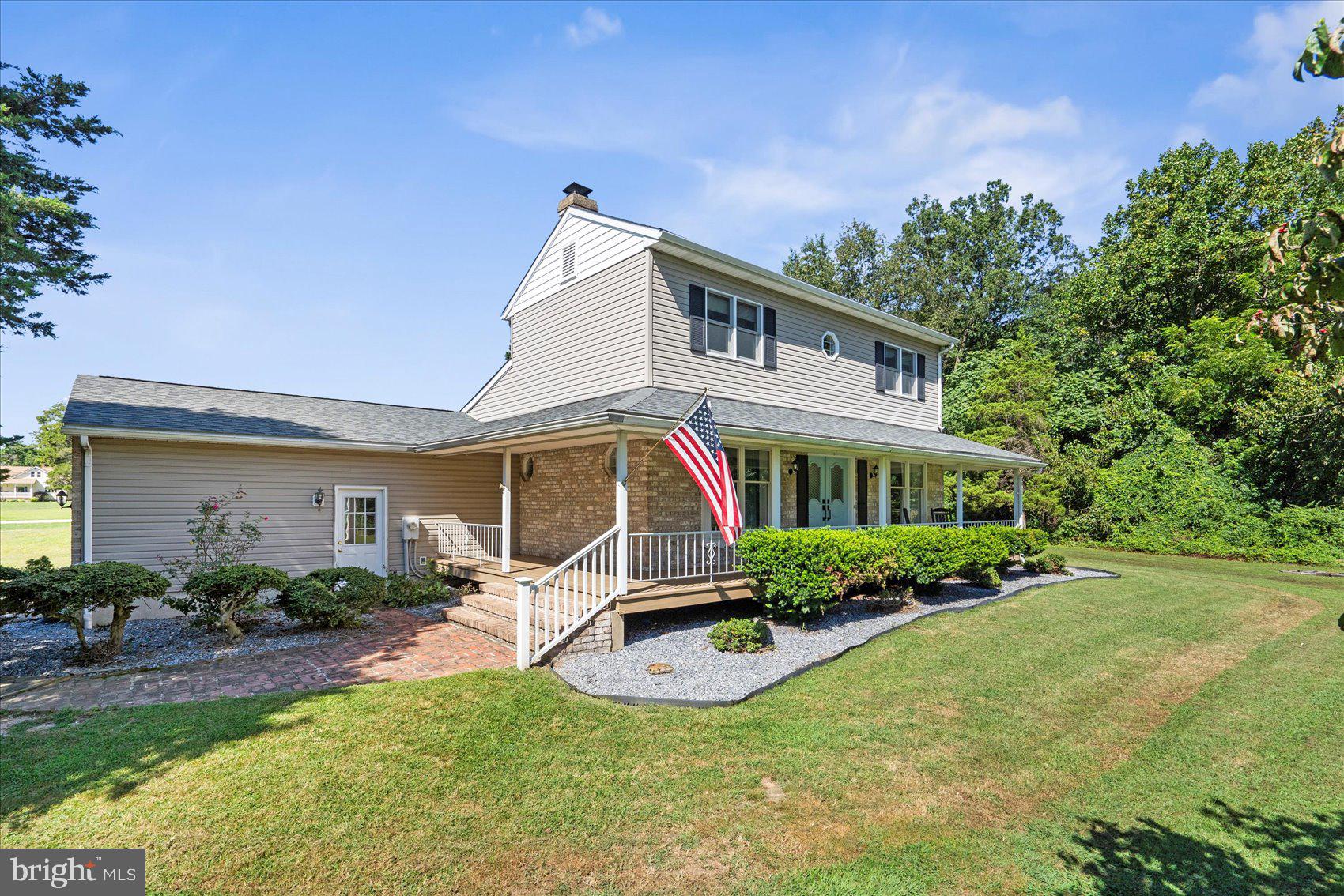 972 Bird River Beach Road Middle River, MD 21220 - Photo 4 of 50 a front view of house with yard and outdoor seating