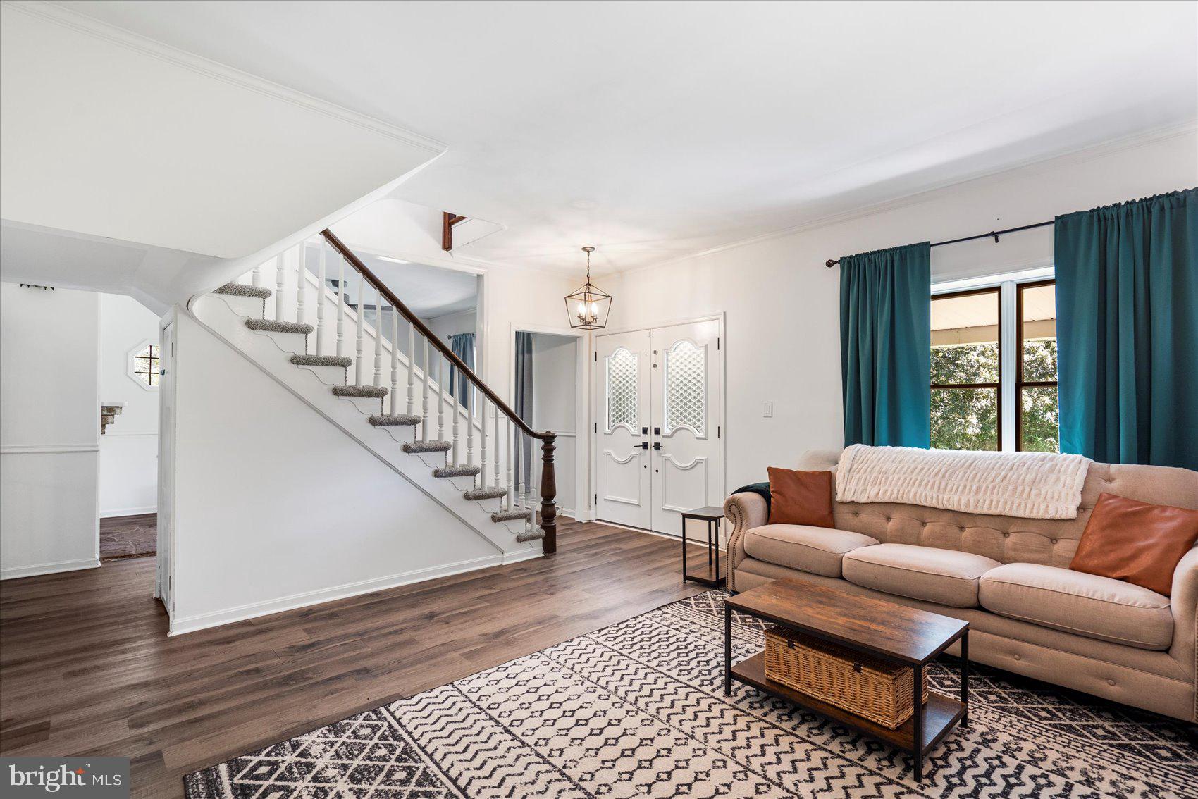 972 Bird River Beach Road Middle River, MD 21220 - Photo 5 of 50 a living room with furniture and a rug