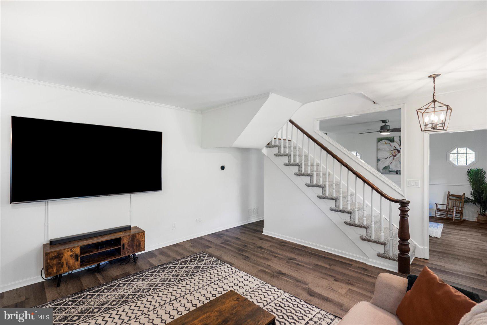 972 Bird River Beach Road Middle River, MD 21220 - Photo 8 of 50 a living room with furniture and a flat screen tv