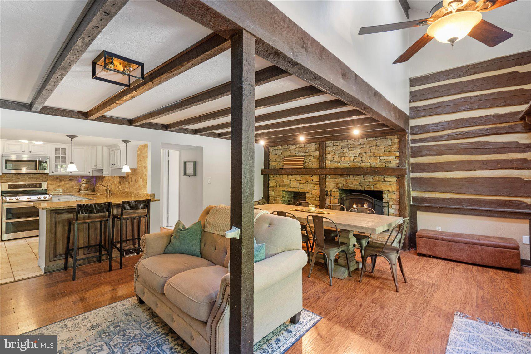972 Bird River Beach Road Middle River, MD 21220 - Photo 9 of 50 a living room with furniture and a table