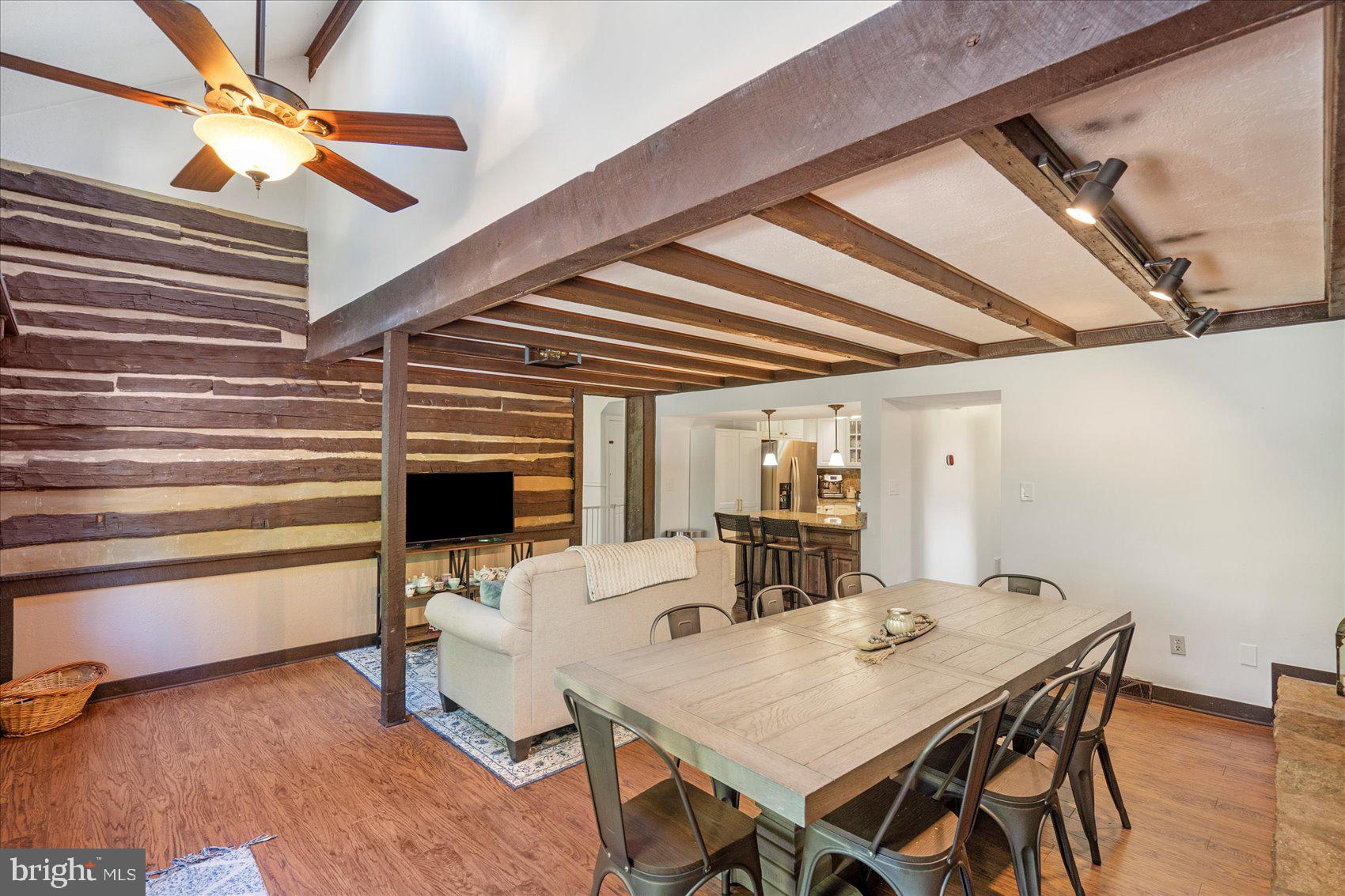 972 Bird River Beach Road Middle River, MD 21220 - Photo 10 of 50 a view of a dining room with furniture and wooden floor