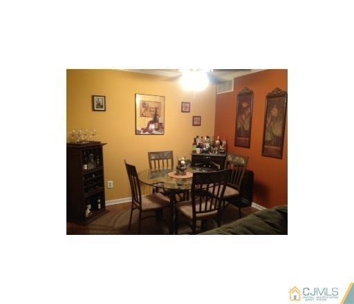 310 Raintree Court Helmetta, NJ 08828 - Photo 3 of 8 a view of a dining room with furniture