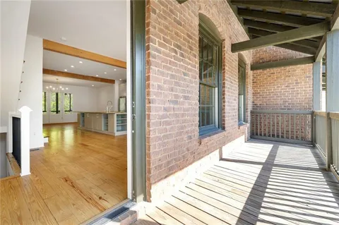 a spacious bedroom with a bed and a couch