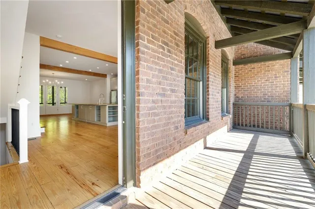 a spacious bedroom with a bed and a couch