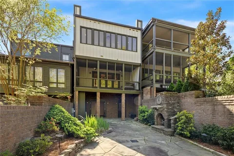 a view of backyard with large tree