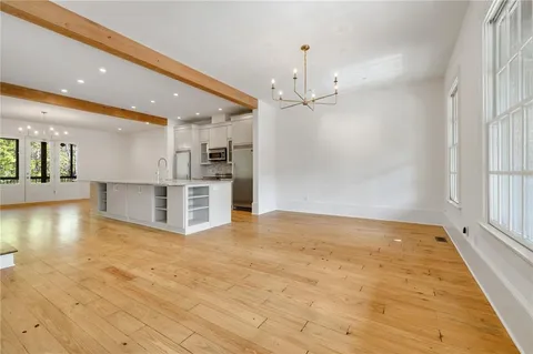 a view of a kitchen with a stove and kitchen view