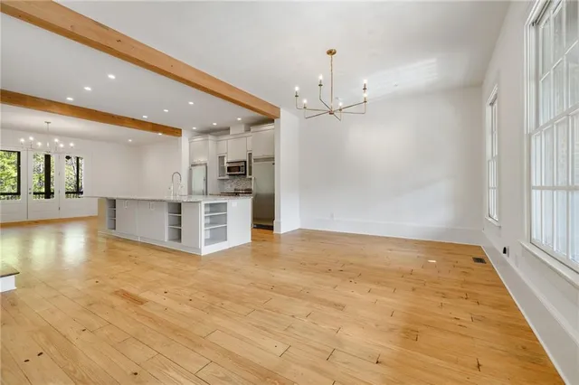 a view of a kitchen with a stove and kitchen view