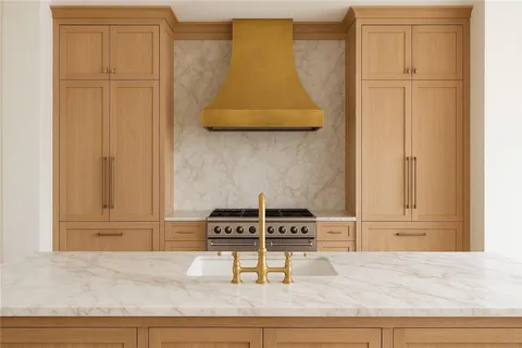 a kitchen with granite countertop a stove and a cabinet