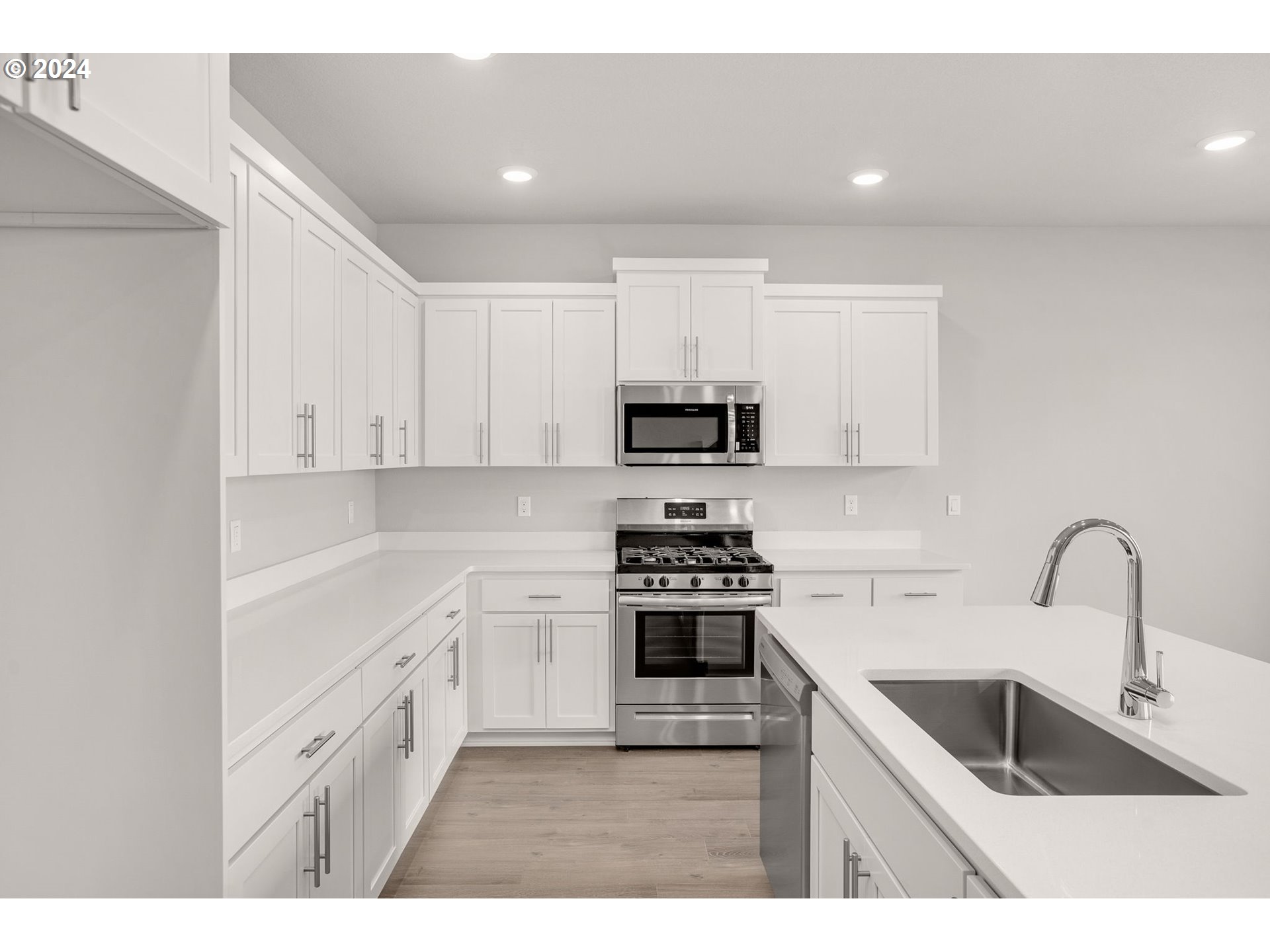 988 Legacy Street Eugene, OR 97402 - Photo 6 of 14 a kitchen with white cabinets and appliances
