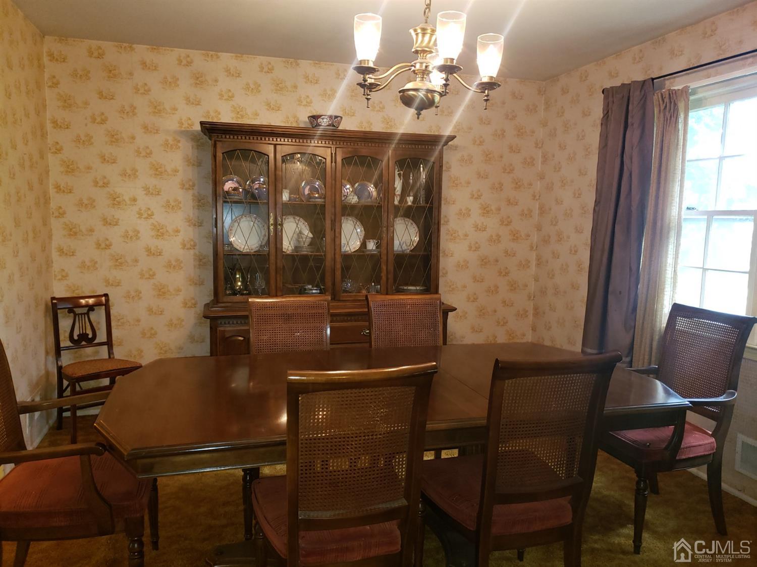 106 Fairfield Road Princeton, NJ 08540 - Photo 13 of 29 a view of a dining room with furniture and chandelier