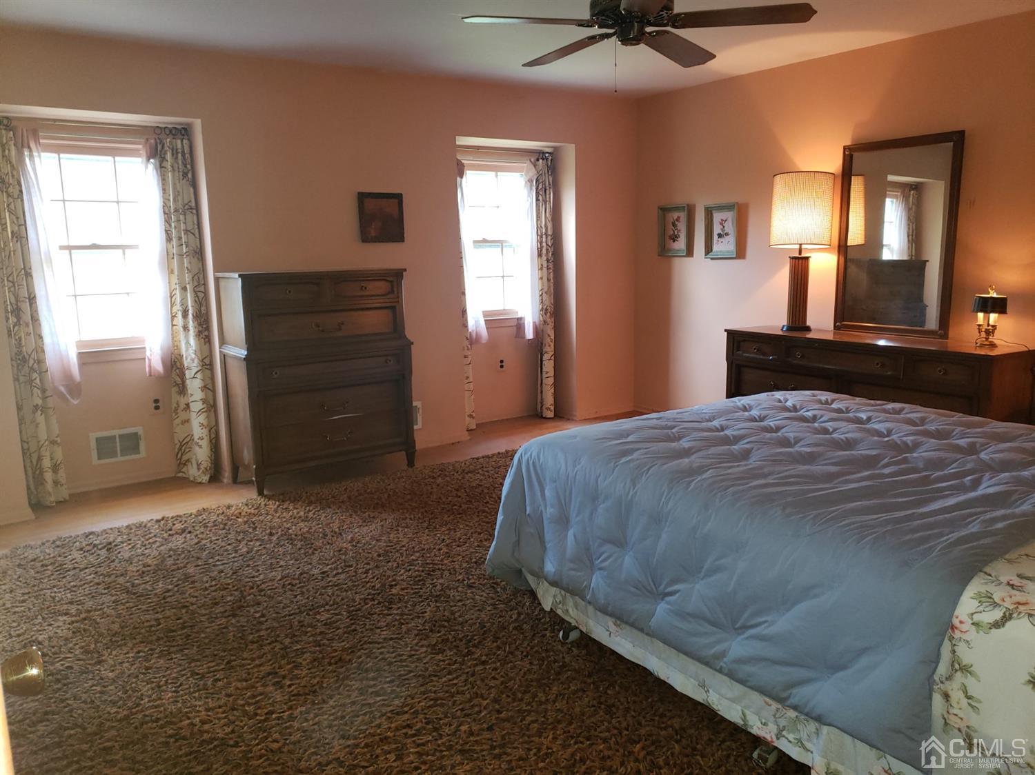 106 Fairfield Road Princeton, NJ 08540 - Photo 15 of 29 a bedroom with a bed and a chandelier