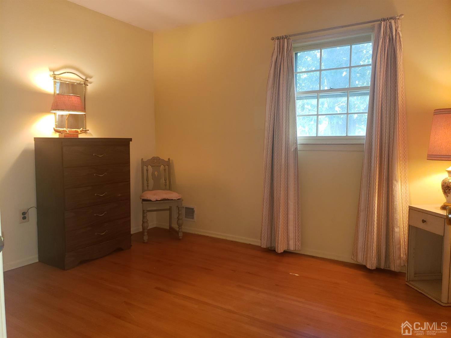 106 Fairfield Road Princeton, NJ 08540 - Photo 23 of 29 wooden floor in an empty room with a window
