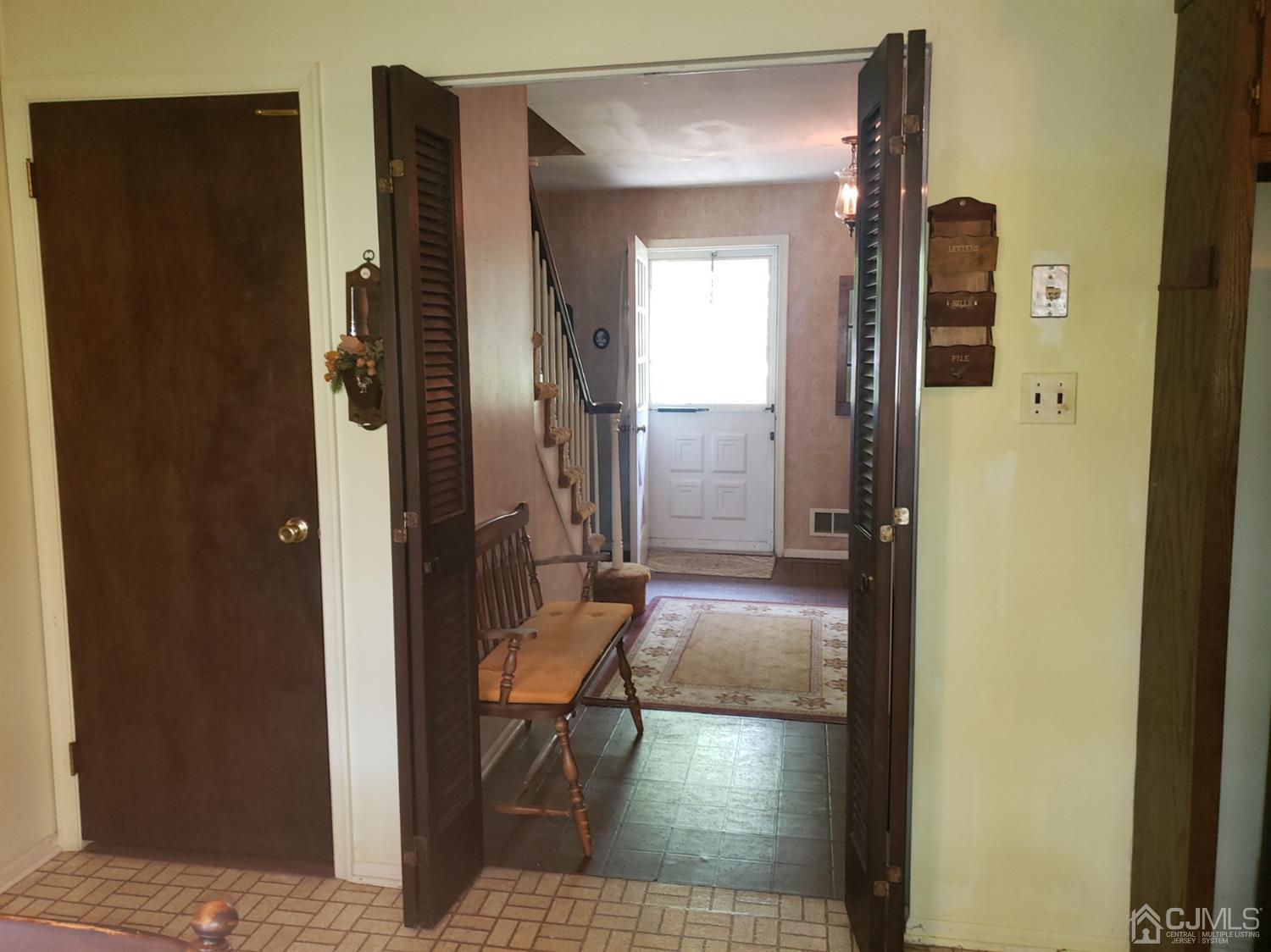 106 Fairfield Road Princeton, NJ 08540 - Photo 7 of 29 a view of a hallway with wooden floor and a livingroom