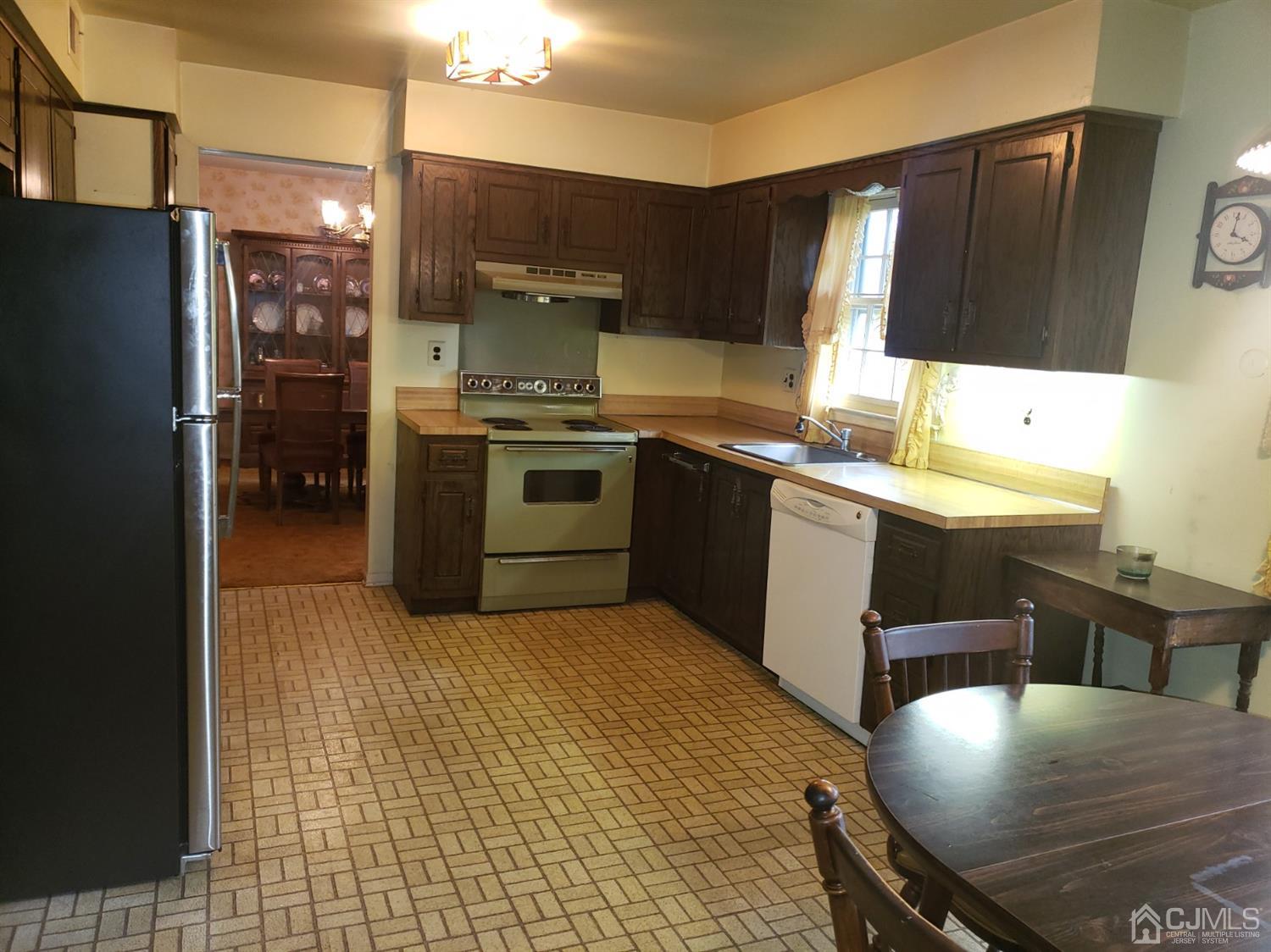 106 Fairfield Road Princeton, NJ 08540 - Photo 8 of 29 a kitchen with stainless steel appliances granite countertop a sink stove and refrigerator