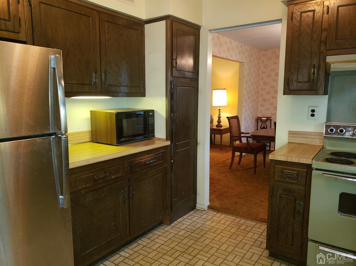 106 Fairfield Road Princeton, NJ 08540 - Photo 9 of 29 a kitchen with a refrigerator a stove top oven a sink and dishwasher